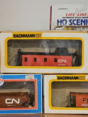 Assorted Model Train Cars and Accessories